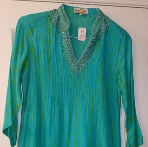 Silk dress or dressy bathing suit cover.